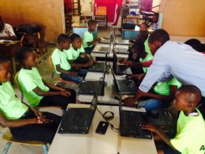 Students learn computer basics in Cite Soleil.